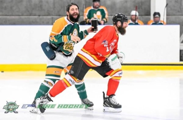 hockey players having fun at 3rd line tournament hockey players dancing on the ice at a 3rd line tournment